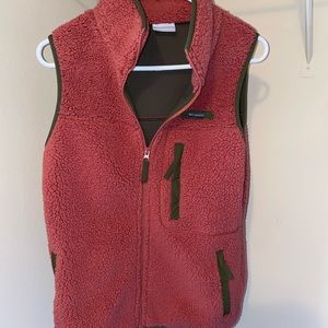 Columbia redish/pink vest with olive green trim.